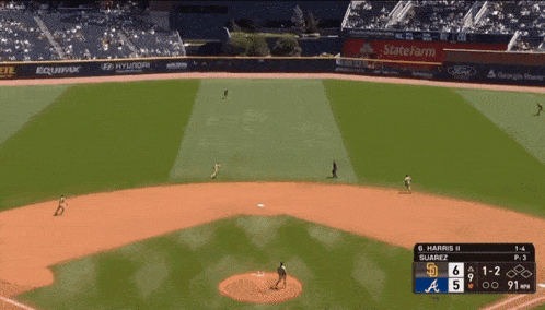 a baseball game is being played in a stadium sponsored by hyundai