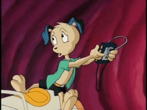 a cartoon character is holding a remote control with the letter l on it
