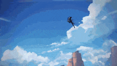 a person flying through a cloudy blue sky with a mountain in the background