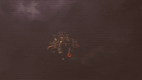 a blurred image of a person holding a gun