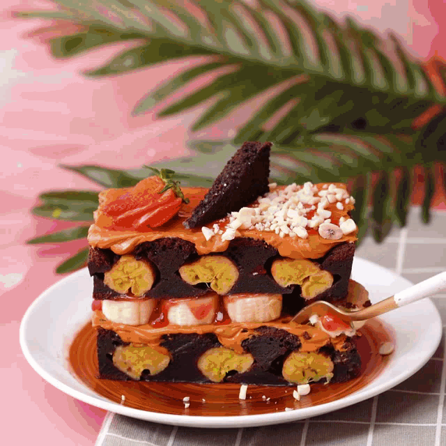 a white plate topped with a slice of banana brownie
