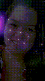 a close up of a woman 's face with a purple and pink background
