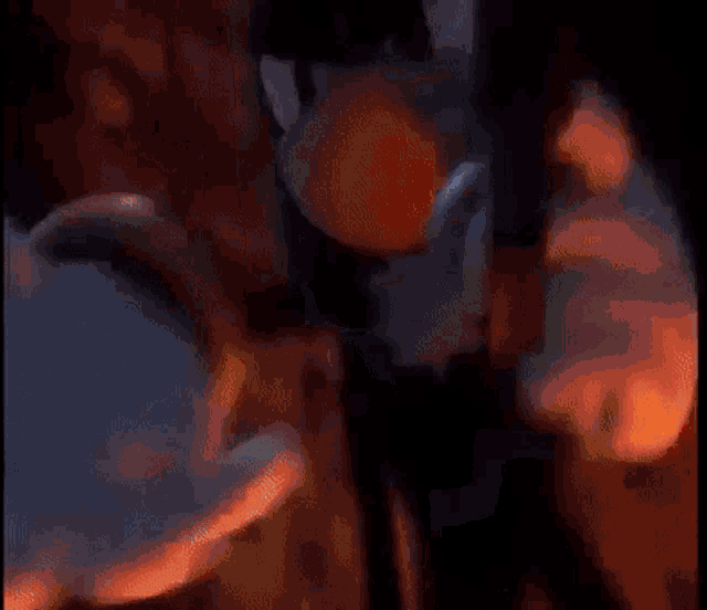 a close up of a person holding a gun in their hands .