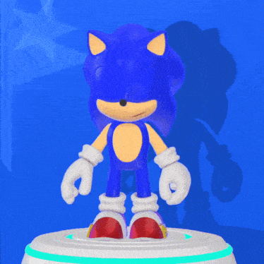 a sonic the hedgehog toy is standing on a white platform