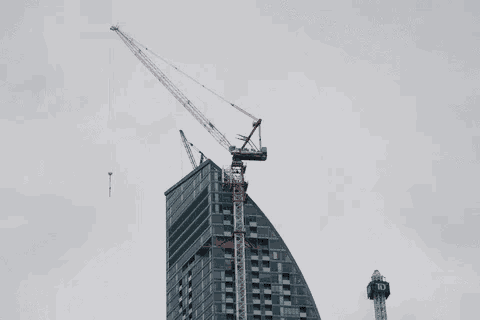 a td bank tower is being built next to a very tall building