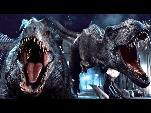 two dinosaurs standing next to each other with their mouths wide open