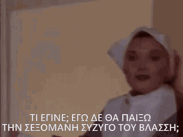 a woman in a nun costume is talking in a foreign language ..