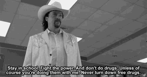 a man in a cowboy hat is saying " stay in school fight the power and don t do drugs "