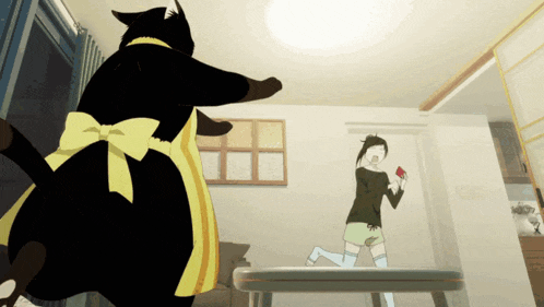 a black cat wearing a yellow apron is playing with a girl