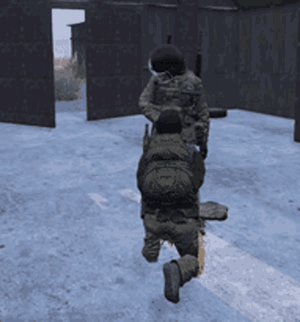 a man in a military uniform is kneeling on the ground