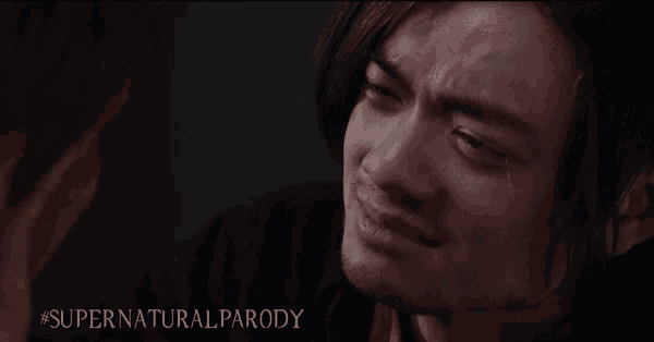 a close up of a man 's face with a caption that says supernatural parody .