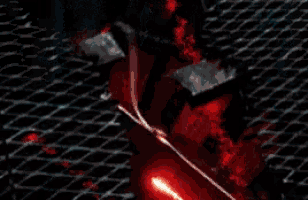 a close up of a bloody saw blade on a metal surface