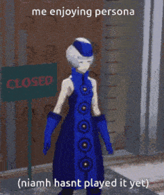 a woman in a blue dress standing in front of a closed sign