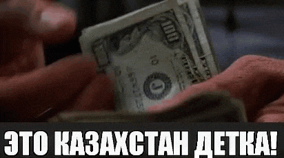 a person is holding a stack of money in their hands and a foreign language is visible .