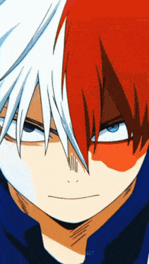 a close up of a boy with red and white hair