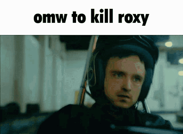 a man wearing a helmet with the words omw to kill roxy written above him
