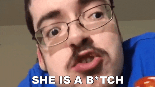 a man with glasses and a mustache is saying she is a b * tch