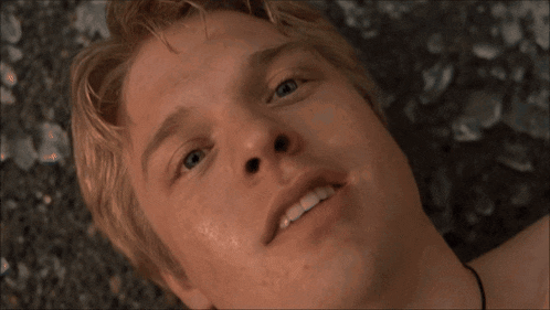 a close up of a man 's face and neck