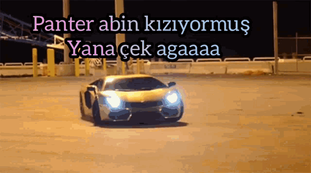 a yellow sports car is driving down a road with the words panter abin kiziyormus yanacek agaaaa written above it