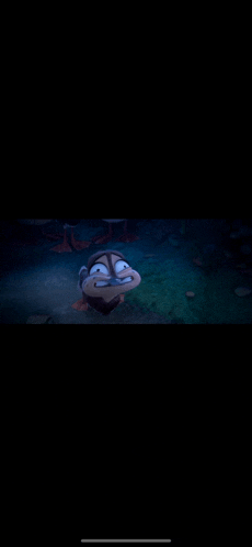 a cartoon character is swimming in the dark and making a funny face