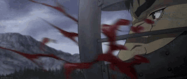 a man in a helmet with blood coming out of his nose