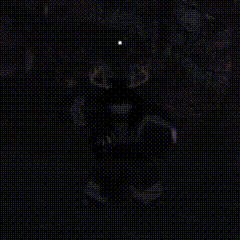a black and white photo of a person standing in the dark