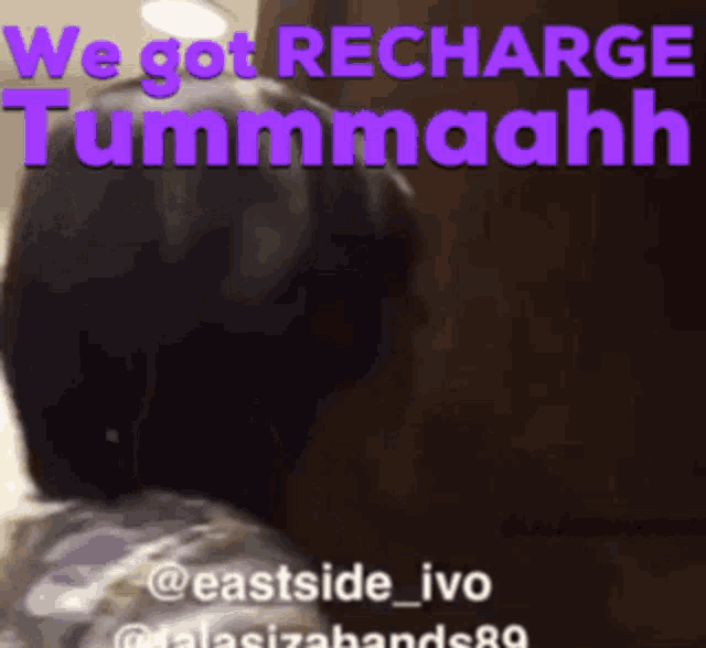 a purple and white sign that says we got recharge tummaahk