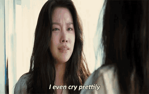a woman is crying while looking at herself in the mirror and saying `` i even cry prettyly '' .
