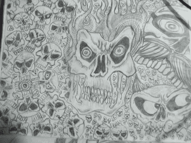 a black and white drawing of a skull with the word skull on the bottom right