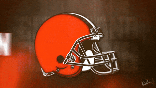 a cleveland browns football helmet on a brown and white background