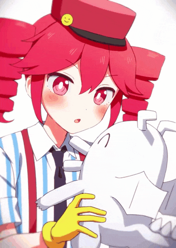 a girl with red hair and a smiley face on her hat holds a white cat
