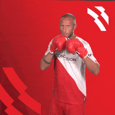 a man wearing boxing gloves and a jersey that says utrecht on it