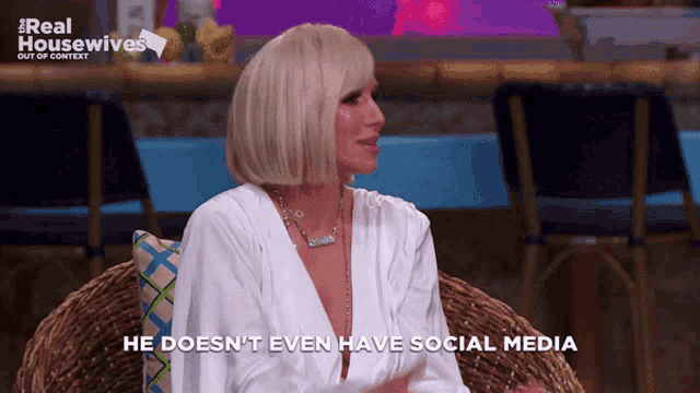 a woman sitting in a chair with the words " he does n't even have social media "