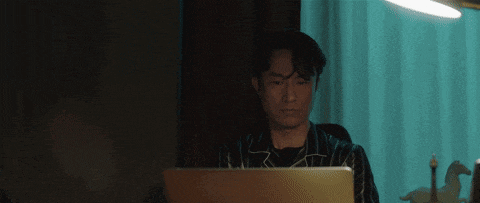 a person is typing on a laptop keyboard with the letters a b c and d visible