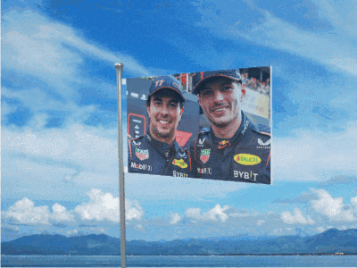 a flag that says bybit on it is flying in the air