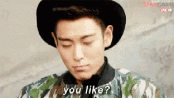 a young man wearing a hat and a camouflage jacket is asking if you like .