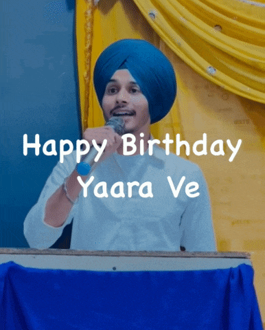 a man wearing a blue turban is speaking into a microphone with the words happy birthday yaara ve behind him
