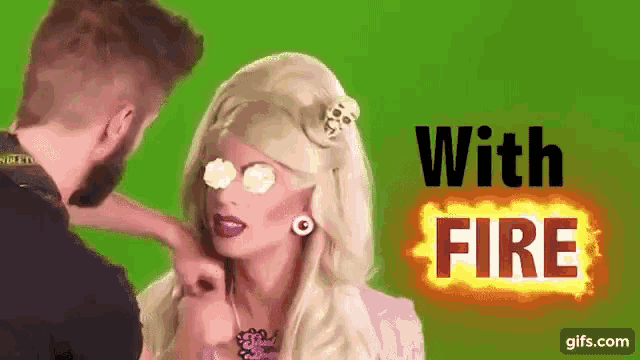 a man is touching a woman 's face and the words with fire are on the screen .