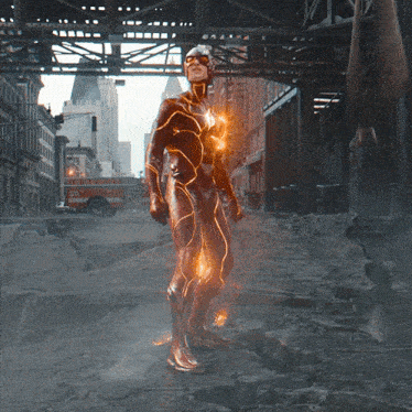 a man in a flash costume is standing in a city street