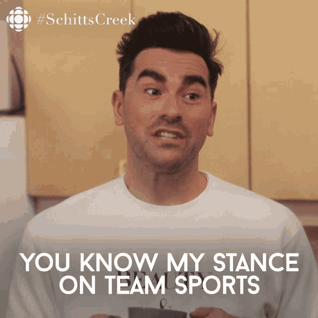 a man in a white shirt with the words you know my stance on team sports below him