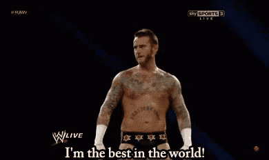 a shirtless man with tattoos on his chest is saying `` i 'm the best in the world '' on a tv screen .