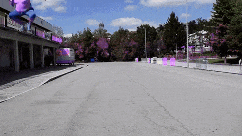 an empty street with a purple sign that says ' abercrombie & fitch '