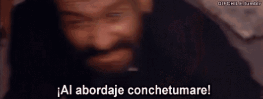 a man with a beard and mustache is screaming in spanish