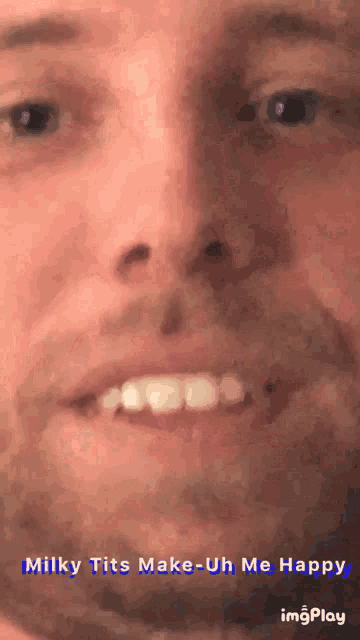 a close up of a man 's face with the words milky tits make-uh me happy on the bottom