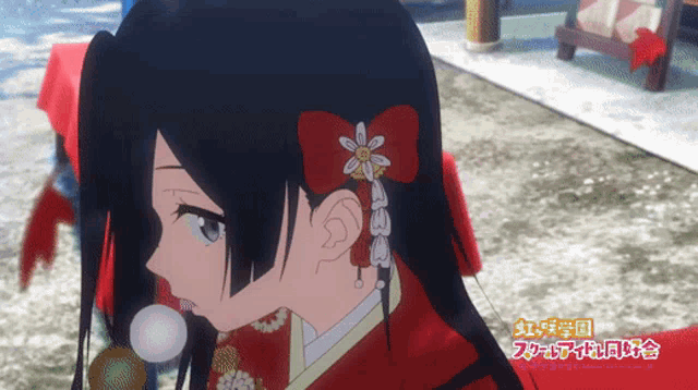 a girl with a red bow in her hair has chinese writing on the bottom right corner