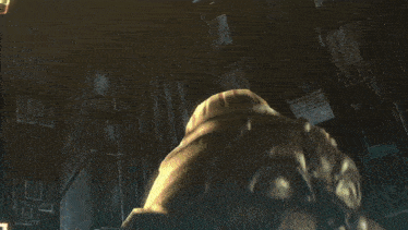 a statue in a dark room with the name taison nyudo on the bottom