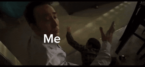 a person 's hand is reaching out towards another person with the words `` me '' written on the screen .