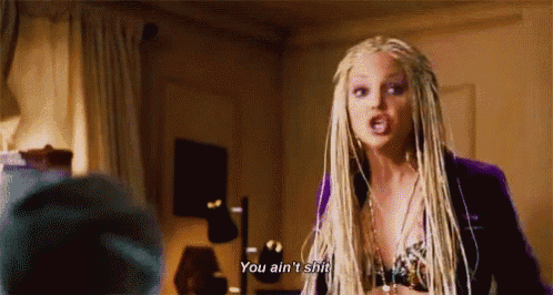 a woman with blonde braids is talking to a man and says you ain 't shit .
