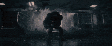 a person is standing in front of a large light