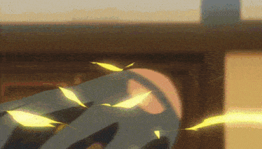 a close up of a person 's face with yellow leaves flying around them